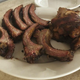 a plate of barbecued ribs and chicken